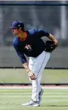  ?? Karen Warren / Staff photograph­er ?? A year-round throwing program has Astros pitcher Zack Greinke feeling stronger than normal this spring.