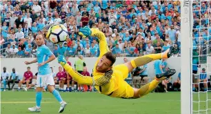  ?? AFP ?? Goaltender Hugo Lloris of Tottenham dives to make a save against Manchester City during the first half of the Internatio­nal Champions Cup match in Nashville, Tennessee. —