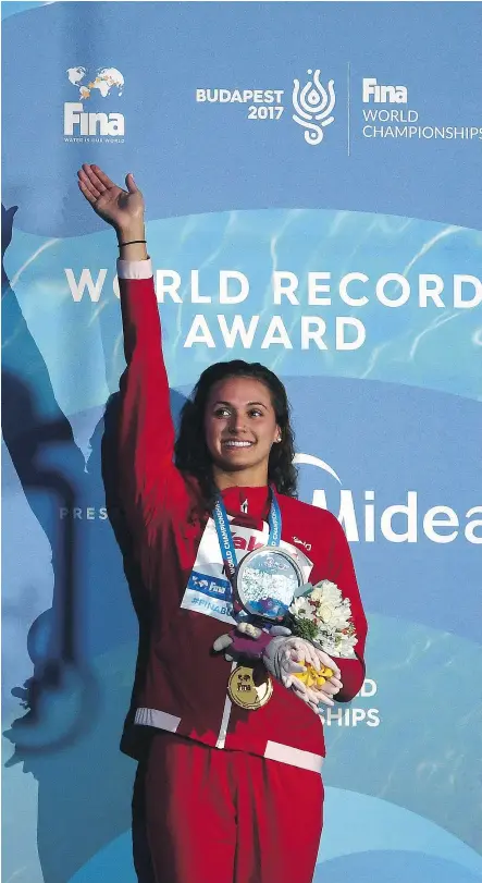  ?? — GETTY IMAGES ?? Canada’s Kylie Masse set a new world record en route to winning gold in the women’s 100-metre backstroke Tuesday at the Budapest 2017 FINA World Championsh­ips in Hungary.