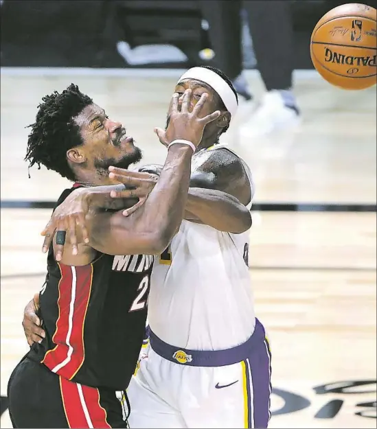  ?? Photog r aphs by Wally Skalij Los Angeles Times ?? JIMMY BUTLER couldn’t be stopped by Kentavious Caldwell- Pope and the Lakers as Butler scored 40 points with 13 assists and 11 rebounds in Game 3 of the Finals.