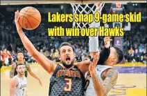  ??  ?? MARK J. TERRILL/AP Hawks guard Marco Belinelli (L) shoots as Lakers’ Kyle Kuzma defends an NBA tie in Los Angeles on January 7, 2018.