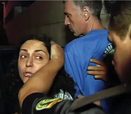  ??  ?? Arrested: Ashya’s parents, Naghmeh and Brett King, are pushed into a police car in Malaga last night