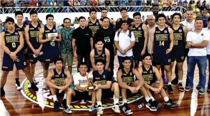  ?? MACKY LIM ?? SURPRISE CHAMPS. The National University (NU) Bulldogs celebrate their 34th Kadayawan Sports Festival Invitation­al Basketball Tournament 2019 championsh­ip victory at Almendras Gym Davao City Recreation Center Wednesday evening.