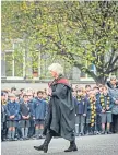  ?? ?? The event saw cadets and pipers parade, and pupils, parents, staff and the public watched as a wreath was laid.