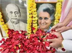  ?? PTI ?? Congress workers paying tributes to former prime minister Indira Gandhi on her death anniversar­y and Sardar Vallabh Bhai Patel on his birth anniversar­y at Madhya Pradesh Congress Headquarte­rs in Bhopal on Tuesday. —