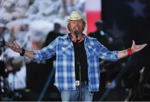  ?? (Photo by Chris Pizzello/invision/ap, File) ?? Toby Keith performs at ACM Presents an All-star Salute to the Troops in Las Vegas. Keith, who died on Monday of cancer at age 62, is being celebrated for his immense catalog of songs. But his 2002 track “Courtesy Of The Red, White And Blue (The Angry American)” may be remembered most.