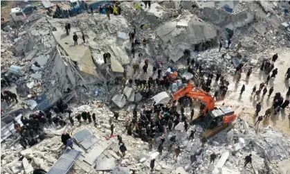  ?? Omar Haj Kadour/AFP/Getty ?? People search for survivors following the earthquake in Besnia, in Syria's rebel-held Idlib province, on Monday 6 February 2023. Photograph: