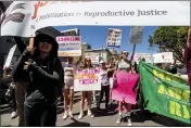  ?? NOAH BERGER — AP PHOTO ?? Abortion rights protesters march in San Francisco on Saturday in the face of an anticipate­d Supreme Court decision that could overturn women's right to an abortion.