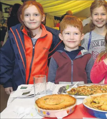  ??  ?? Competitor­s in the apple pie competitio­n at the Perry Court Farm fayre, Emily Judge, Josh