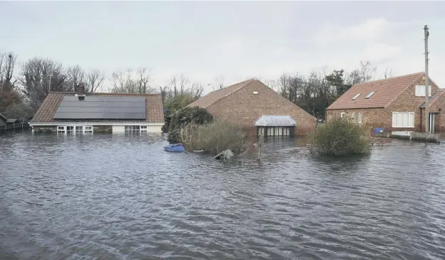  ??  ?? 0 While Scotland prepared to see record rainfall for February confirmed, parts of northern England remained under water as flood waters failed to recede