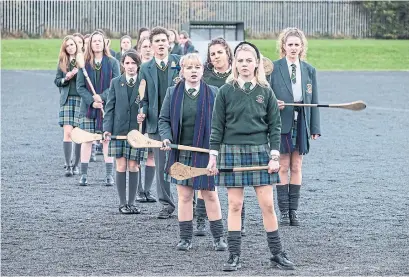  ?? NETFLIX TRIBUNE NEWS SERVICE ?? Derry Girls blends the typical teenage hijinks with jokes about bomb scares, British soldiers and the IRA.