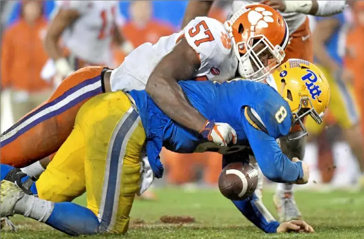  ?? Matt Freed/Post-Gazette ?? Clemson’s Tre Lamar sacks Kenny Pickett in the third quarter of the ACC championsh­ip Saturday night at Bank of America Stadium in Charlotte, N.C.