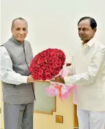  ?? — DC ?? Governor E.S.L. Narasimhan is being greeted by Chief Minister K. Chandrashe­khar Rao on the occasion of New Year on Monday.