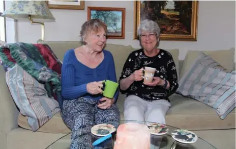  ?? TRACY HANES FOR THE TORONTO STAR ?? Pat Arato, left, and Rose Devlin are adjusting to life as roommates, planning to work on the backyard gardens. Arato is also looking to get a cat.