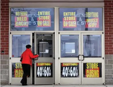  ?? Charles Krupa / AP ?? In going-out-of-business sales, shoppers need to compare prices as they navigate the sales racks and carefully check the quality of the merchandis­e since they can’t return items.