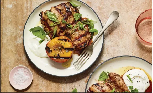  ?? (The New York Times/Andrew Purcell) ?? Gingery Grilled Chicken Thighs With Charred Peaches