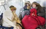  ??  ?? Friends Vanessa Birch, left, Autumn Clark and Aly Gagliardi were the first in line to see The Killers perform Friday night at the ACC.