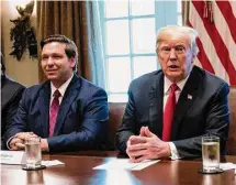  ?? Jabin Botsford/The Washington Post ?? Ron DeSantis, then-Florida governor-elect, listens as then-President Donald Trump speaks during a meeting with governors-elect at the White House in 2018.