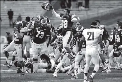  ??  ?? Colorado State players
AP/MATT YORK
leap in celebratio­n Saturday after the Rams defeated Washington State 48-45 in the Las Vegas Bowl. Jared Roberts kicked a 41-yard field goal with 3 seconds left to seal the victory.