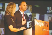  ?? MICHELLE BERG ?? NDP Leader Ryan Meili reacts to the news of another Sask. Party majority with his wife, Mahli Brindamour, at his side Monday.