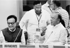  ?? PHOTO: PTI ?? (From right) Union Finance Minister Arun Jaitley with Puducherry Chief Minister V Narayanasa­my and Revenue Secretary Hasmukh Adhia at the17th GST Council meet at Vigyan Bhavan in New Delhi on Sunday