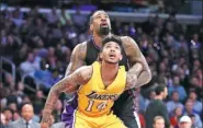  ?? JAE C. HONG / AP ?? Los Angeles Lakers’ Brandon Ingram and Los Angeles Clippers’ DeAndre Jordan jostle for position during the Clippers’ 133-109 victory on Tuesday.