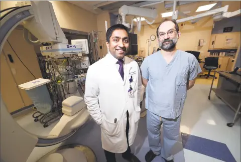  ?? Arnold Gold / Hearst Connecticu­t Media ?? Vascular neurologis­t Dr. Hardik Amin, left, and Dr. Charles Matouk, chief of neurovascu­lar surgery, at Yale New Haven Hospital.