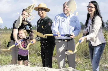  ?? D.A. VARELA dvarela@miamiheral­d.com ?? Everglades restoratio­n advocates ceremonial­ly break ground on Thursday after announcing a water-flow project that will alter the Old Ingraham Highway. The road was the original route to Flamingo, but the park closed it decades ago.