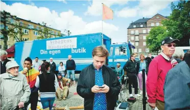  ?? New York Times ?? Eric Isberg, who was chosen to run Sweden’s national Twitter account for a week, in Trollhatta­n, Sweden, in 2012. Citizens would post on topics as varied as manga comics and ugly sweaters.