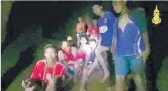  ?? ASSOCIATED PRESS ?? This grab taken from video provided by the Thai Navy Seal shows the 12 boys and their soccer coach found alive deep inside a partially flooded cave on Monday.