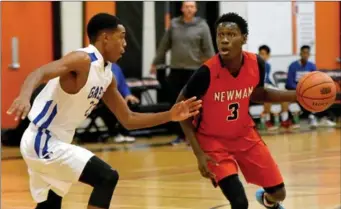  ?? CATHIE COWARD, THE HAMILTON SPECTATOR ?? Cardinal Newman’s Maleik Gordon looks to drive the ball past Cathedral’s Zanyah Jones during the semifinal win Friday. The win set up Newman’s final with St. Benedict.