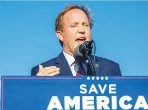  ?? (Brandon Bell/Getty Images/TNS) ?? Texas Attorney General Ken Paxton speaks at the Save America rally Oct. 22 in Robstown, Texas. The attorney general plans to keep up his relentless legal assault on President Joe Biden’s agenda.