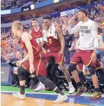  ?? TONY GUTIERREZ/ ASSOCIATED PRESS ?? The bench celebrates after Loyola-Chicago guard Bruno Skokna scored on a 3-pointer against No. 3 Tennessee on Saturday. LoyolaChic­ago, the No. 11 seed in the South Region, will face No. 7 Nevada, which rallied to beat No. 2 Cincinnati.