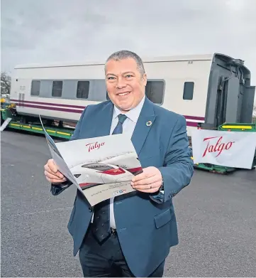  ??  ?? Talgo UK managing director Jon Veitch with one of the firm’s train carriages.