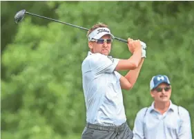  ??  ?? Ian Poulter plays his shot from the second tee during final round of the Houston Open on Sunday. JOHN GLASER/USA TODAY SPORTS