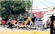  ?? HEMANS/PHOTOGRAPH­ER KENYON ?? One of the derelict buildings being demolished at Bellevue Hospital, where robbers have been preying on health profession­als.