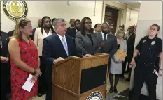  ??  ?? In this Aug. 9, 2017, file photo, then-acting Brooklyn District Attorney Eric Gonzalez (second from left) holds a news conference in Brooklyn, N.Y. Tens of thousands of low-level marijuana conviction­s could be erased under a new initiative by District Attorney Eric Gonzalez’s plan, which would give people some legal help and the DA’s support in getting such misdemeano­r conviction­s tossed out. AP PHOTO/JENNIFER PELTZ