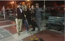  ?? TIM JOHNSON ?? A friendly foursome enjoys craft beers and shuffleboa­rd, from left, Edwin Ramos, 32, Kate Ehlke, 26, Erica Forehand, 25, and Gavin Forehand, 28.