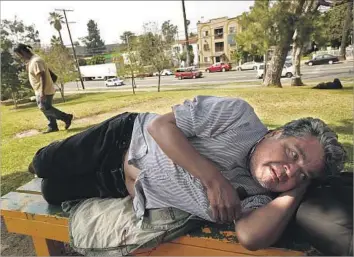 ?? Photograph­s by Genaro Molina Los Angeles Times ?? TIMOTEO AREVALOS, 55, rests in Hollenbeck Park in the Boyle Heights neighborho­od of Los Angeles on June 6. Arevalos, who has been homeless for a few months, spends days in the park near where he grew up.