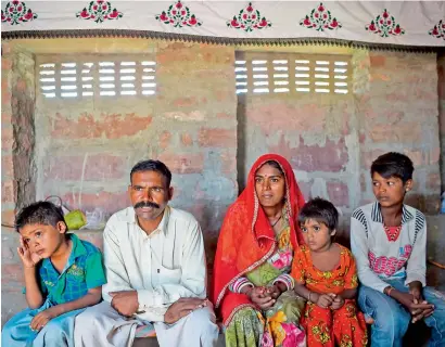  ?? AFP ?? A family of Pakistani Hindus living in an unauthoris­ed settlement in Jodhpur in India’s western state of Rajasthan. —