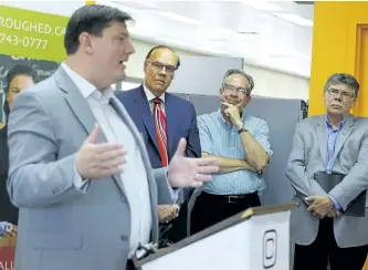  ?? CLIFFORD SKARSTEDT/EXAMINER ?? Innovation Cluster president and CEO Michael Skinner addresses the crowd as Mayor Daryl Bennett, Peterborou­gh MPP Jeff Leal and Peterborou­gh County Warden J. Murray Jones look on during the announceme­nt Wednesday of a new downtown business hub in the...