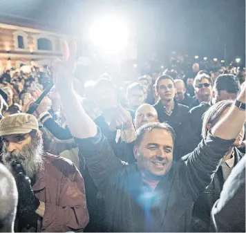  ??  ?? Supporters cheer as Viktor Orbán, Hungary’s re-elected prime minister, delivers a speech at the Fidesz party headquarte­rs