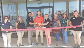  ?? / Sean Williams ?? Local officials from the Polk County Chamber of Commerce joined with members of the Advanced Rehab team at their new home in Cedartown for a ribbon cutting ceremony on Friday, Sept. 7.