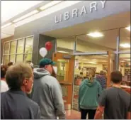  ?? EVAN BRANDT — DIGITAL FIRST MEDIA ?? Residents taking Friday’s tour of the renovated high school stop by the school’s new library.