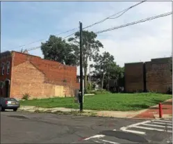  ?? PHOTOS BY NICHOLAS BUONANNO— NBUONANNO@TROYRECORD.COM ?? City officials said that they have interest for possible economic developmen­t to fill in the vacant lot on Remsen and White Street, which used to be where the old Cohoes Movie Theater was located.