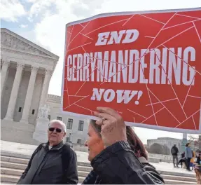  ?? SHAWN THEW/EPA-EFE ?? Demonstrat­ors protest outside the Supreme Court in March as the justices heard the second of two challenges to partisan gerrymande­ring. Rulings on maps from Wisconsin and Maryland are due within weeks.