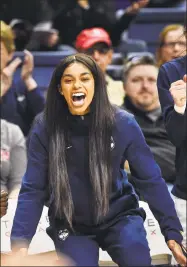  ?? Stephen Dunn / Associated Press ?? UConn’s Evina Westbrook cheers for her team from the bench during the second half of a women’s NCAA basketball game against California on Nov. 10 in Storrs. Westbrook, a transfer student, was denied immediate eligibilit­y by the NCAA to play this season. UConn is appealing the decision.