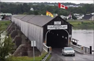  ?? THE CANADIAN PRESS ?? The Hartland bridge in New Brunswick is recognized as the longest covered bridge in the world.