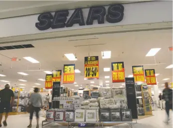  ?? THE CANADIAN PRESS/SEAN KILPATRICK PHOTO ?? Shoppers are seen in a Sears store in Hull, Quebec on Friday, July 21, 2017. The Competitio­n Bureau is investigat­ing allegation­s that prices on some merchandis­e was marked up ahead of the liquidatio­n sales at Sears Canada that began last month, the...