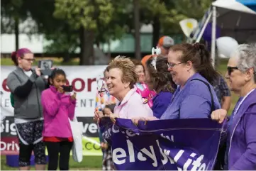  ?? Staff photo by Joshua Boucher ?? Cancer survivors begin the Relay for Life on April 22, 2017, at Four States Fairground­s.